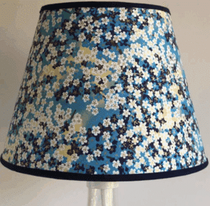A lampshade covered in blue and white floral yuzen paper