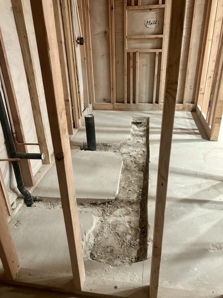 The basement trench filled back in with dirt and cleaned up. 