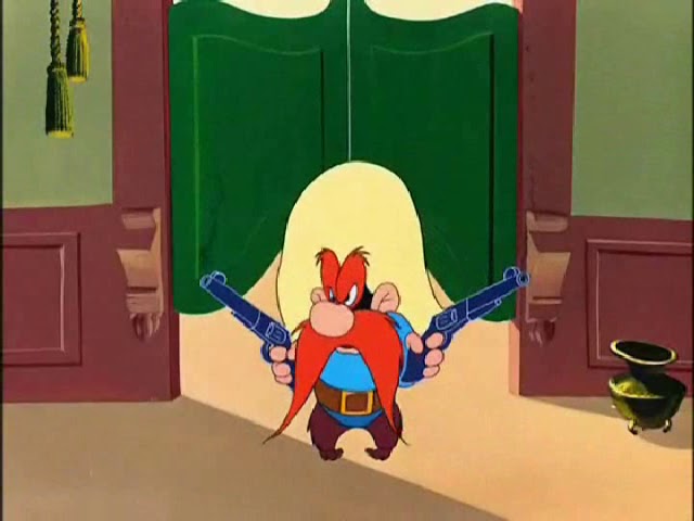 Still from a Looney Tunes cartoon showing Yosemite Sam wearing barrel leg pants in a saloon