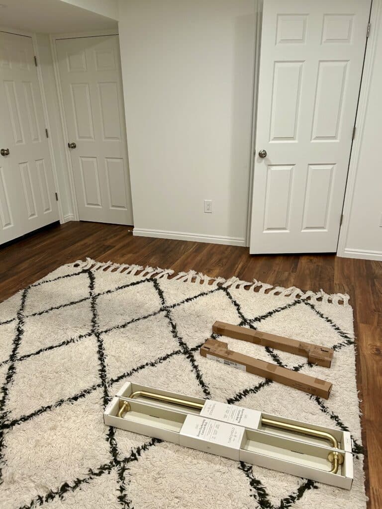 The basement room with a shaggy white and black rug in it