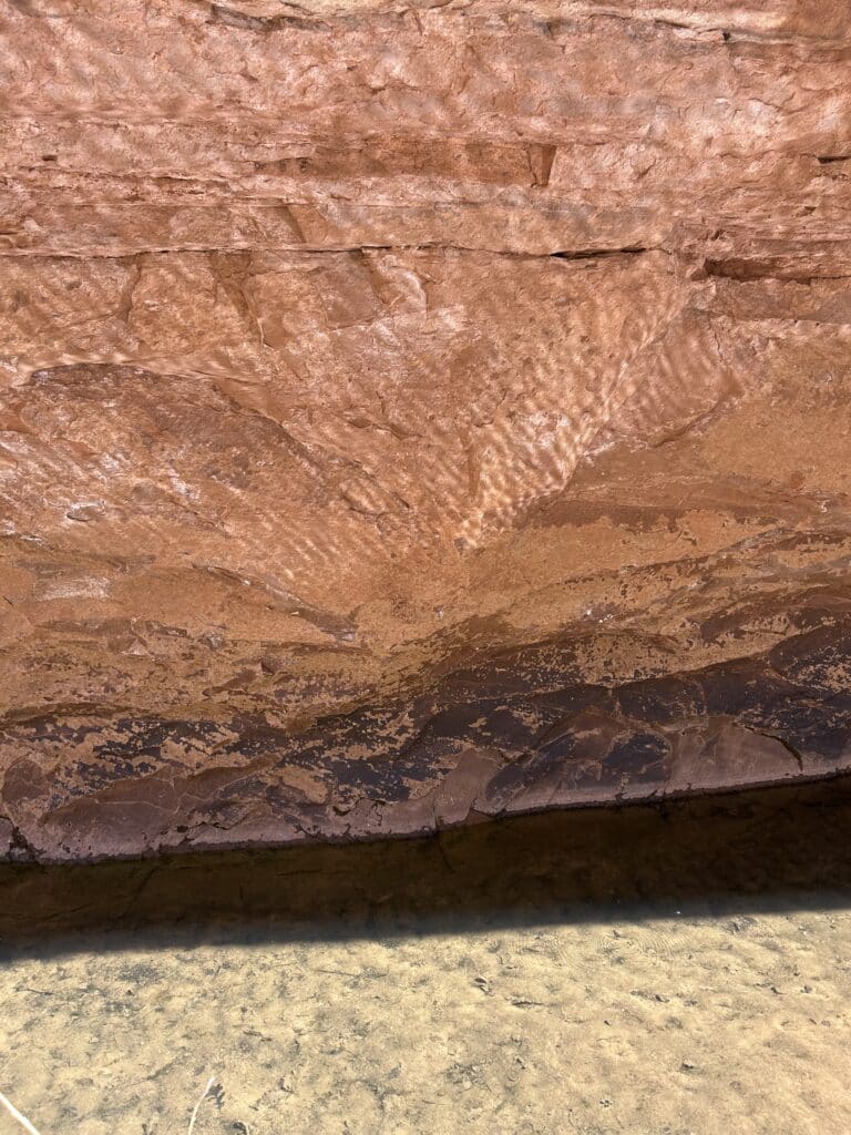 Water reflections on red rock 
