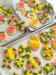 Decorated cookies with pink, yellow, green, and orange frosting