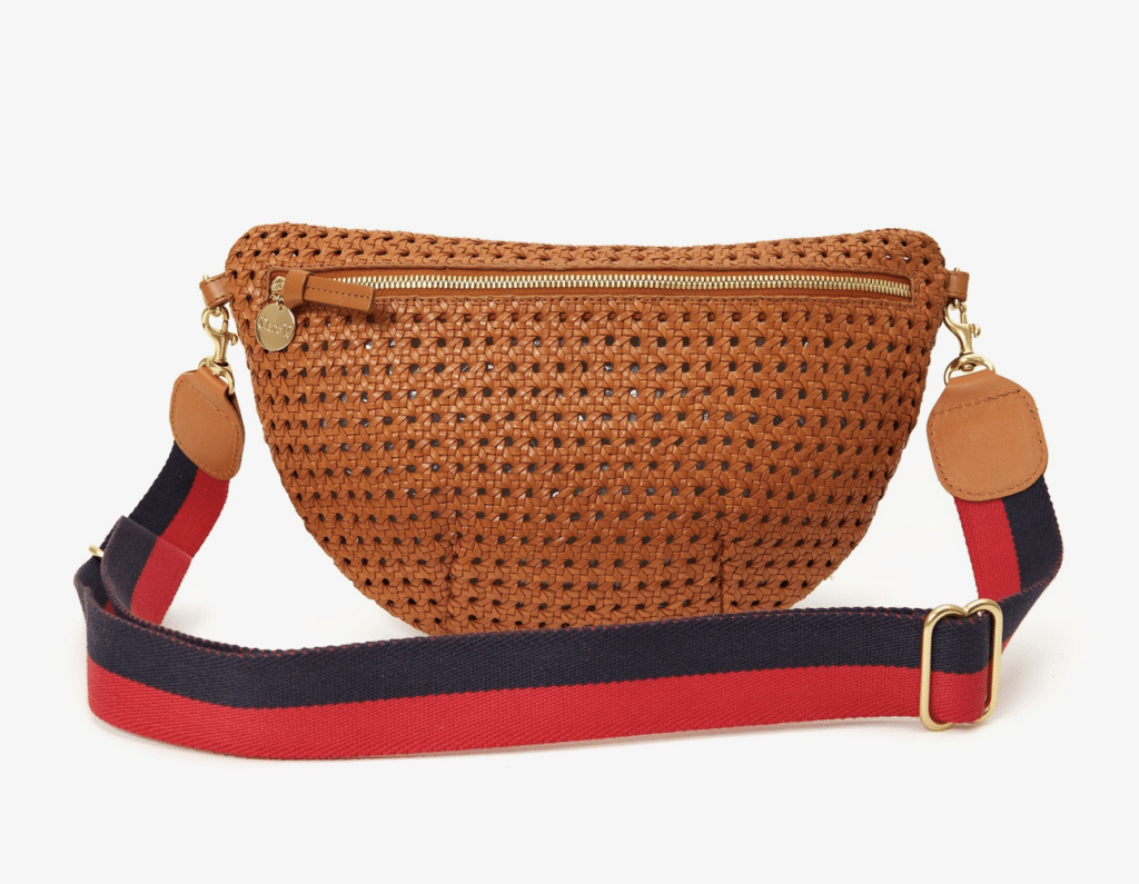 Screenshot from the Clare V site showing a tan bag with a contrast red and navy stripe strap