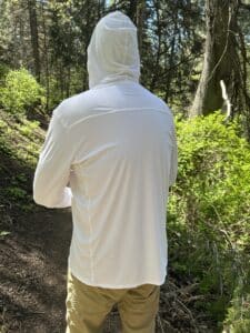 A man in a sun shirt facing away from the camera