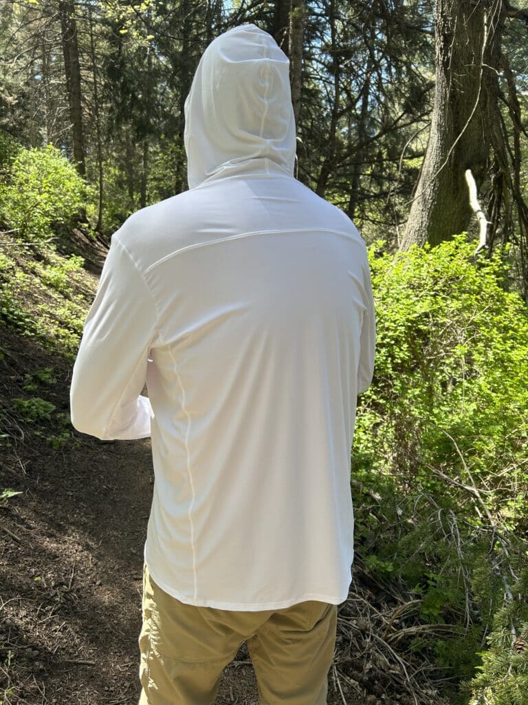 A man in a sun shirt facing away from the camera