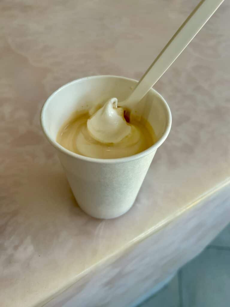 An affogato ice cream on a pink marble countertop