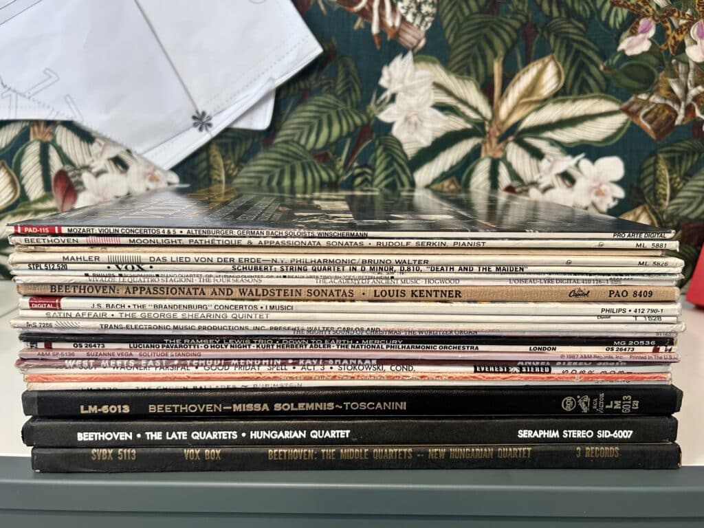 A stack of 30 records on a credenza