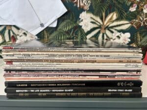 A stack of 30 records on a credenza