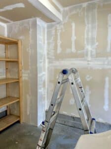 A corner of the garage with drywall mud applied