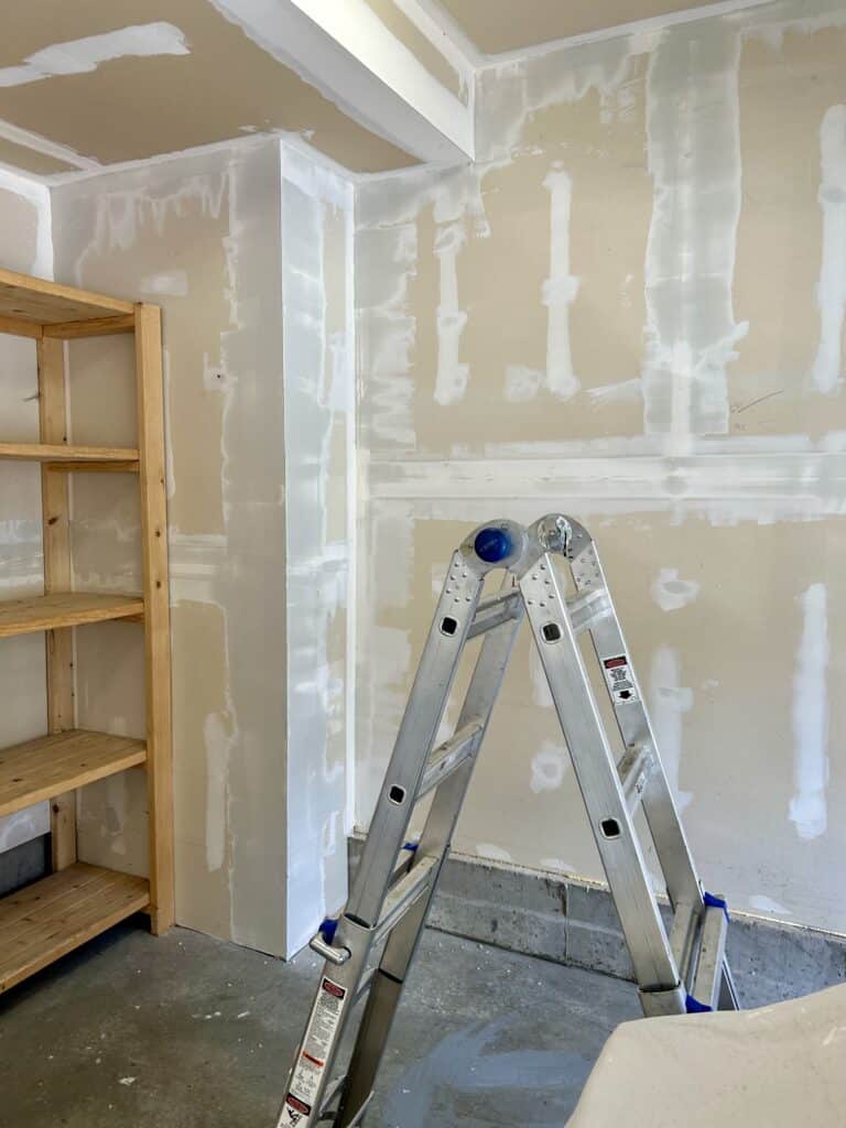 A corner of the garage with drywall mud applied